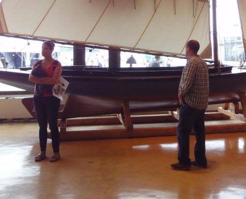 Zeke and Christina in front of a joyful boat